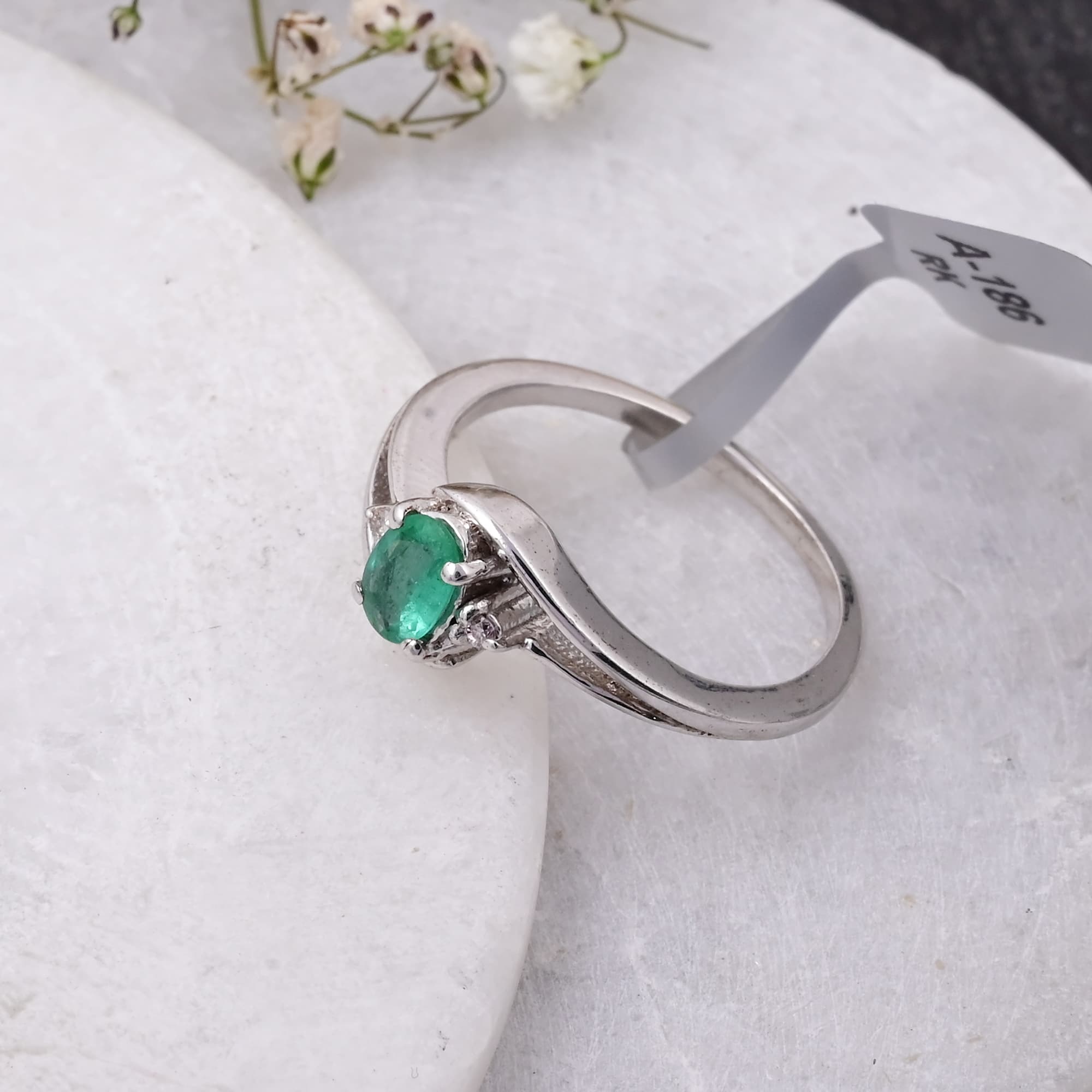 Emerald Whisper Twist Ring